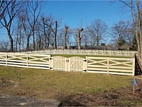 <b>4 foot high pressure treated wood Crossbuck style fence with double arched gate</b>